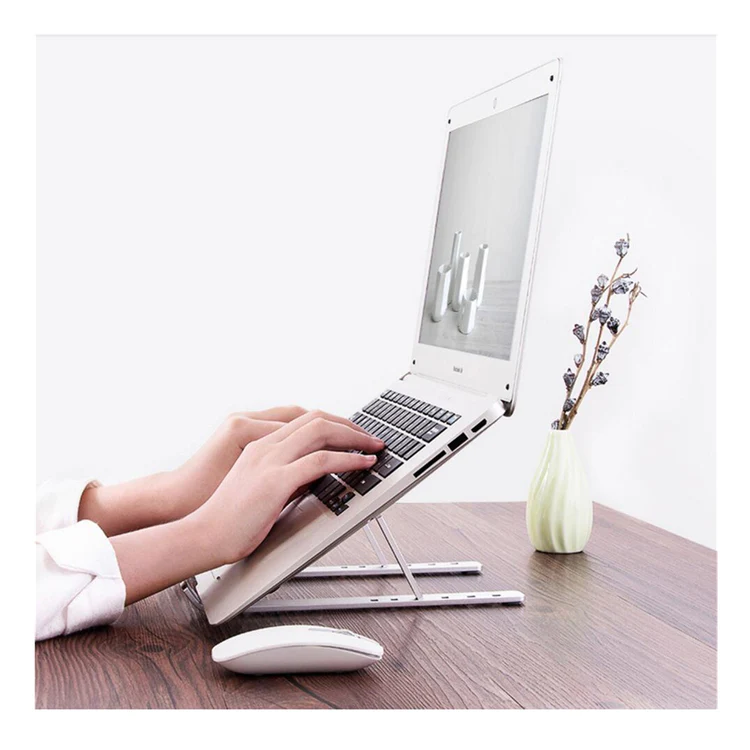 laptopSTandHands_750x